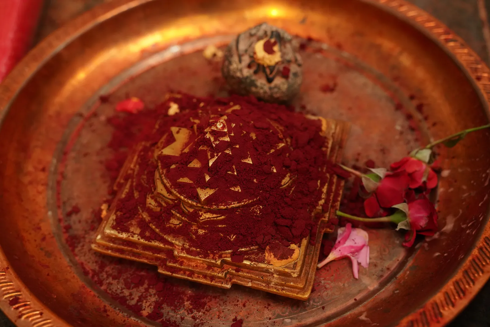 A yantra prepared with kumkum and rose petals for a graha shanti ritual